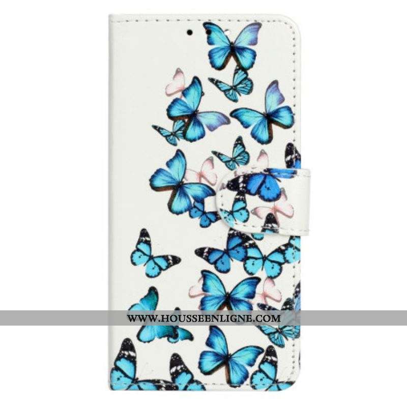 Housse Moto G73 5G Papillons Bleus en Vol à Lanière