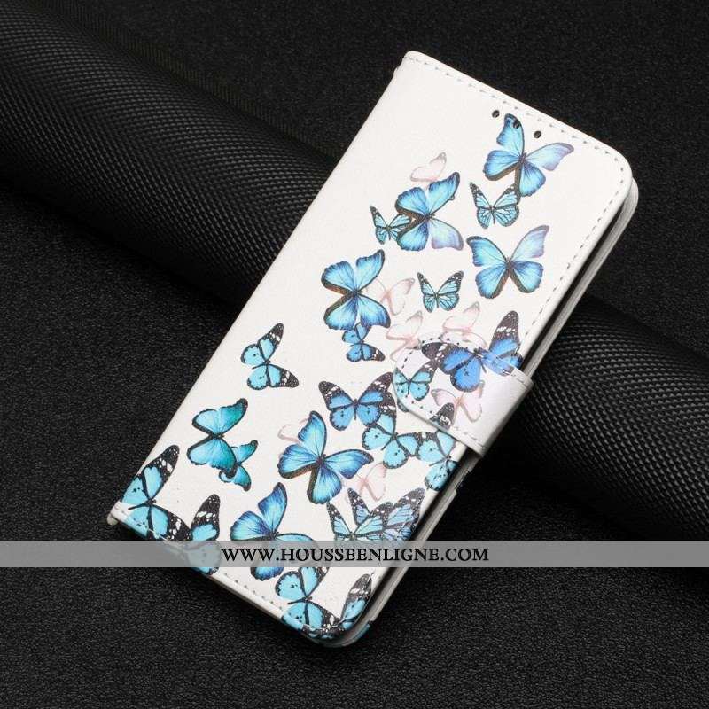 Housse Moto G73 5G Papillons Bleus en Vol à Lanière