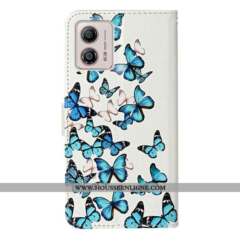 Housse Moto G73 5G Papillons Bleus en Vol à Lanière