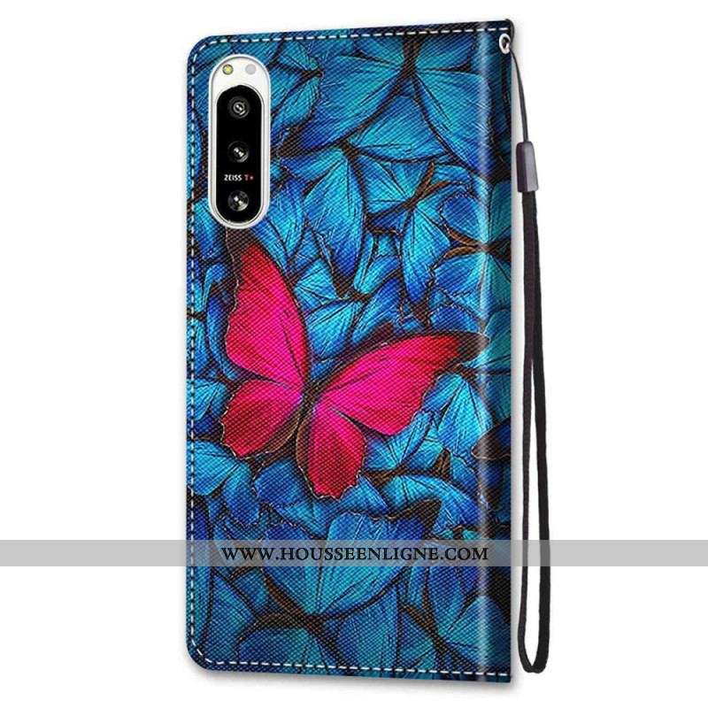 Housse Sony Xperia 5 IV Papillon Rouge Sur Fond Bleu