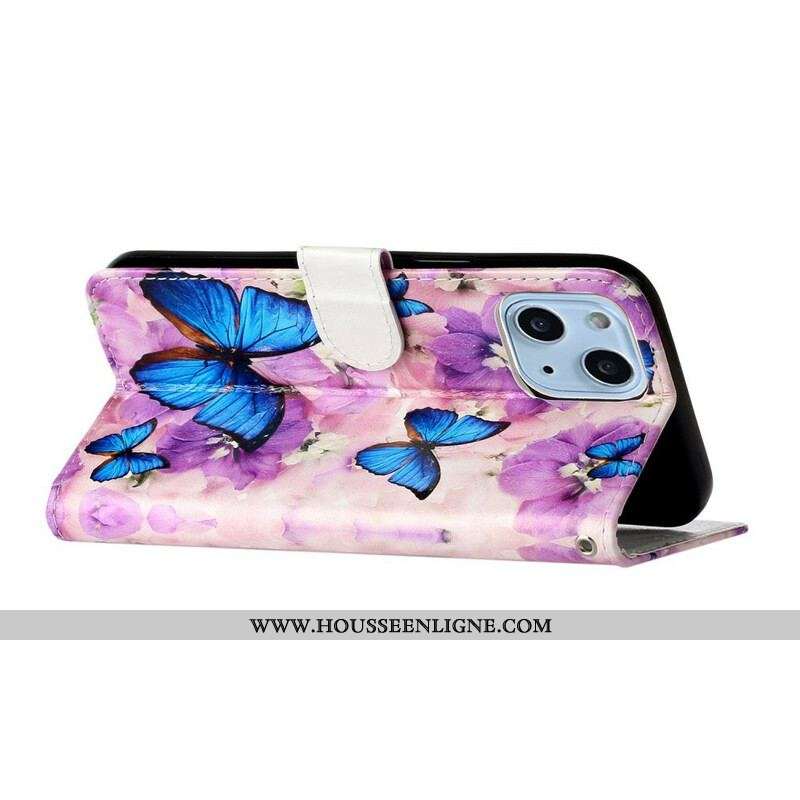 Housse iPhone 13 Mini Papillons Bleus dans les Fleurs