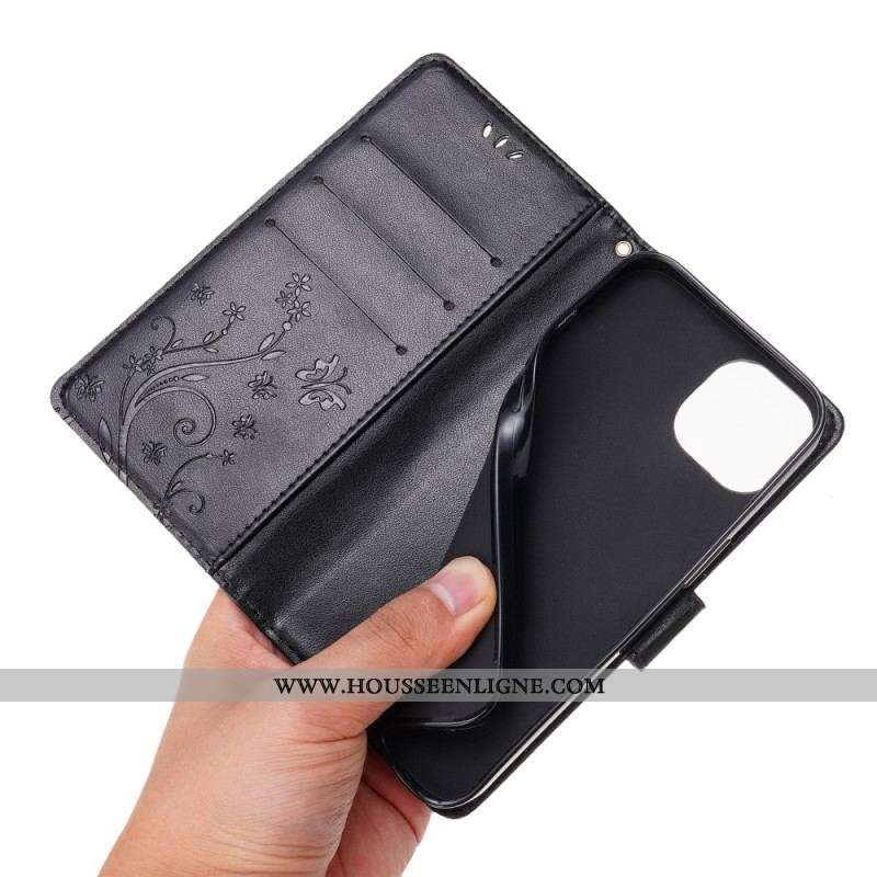 Housse iPhone 15 Fleurs avec Lanière